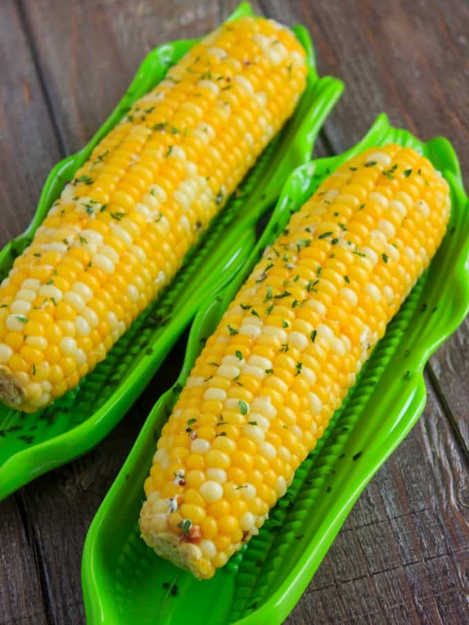 Corn on the Cob Boiled in a Milk Broth on wooden table