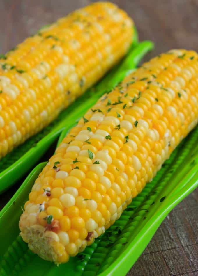 Corn on the Cob Boiled in a Milk Broth on wooden table