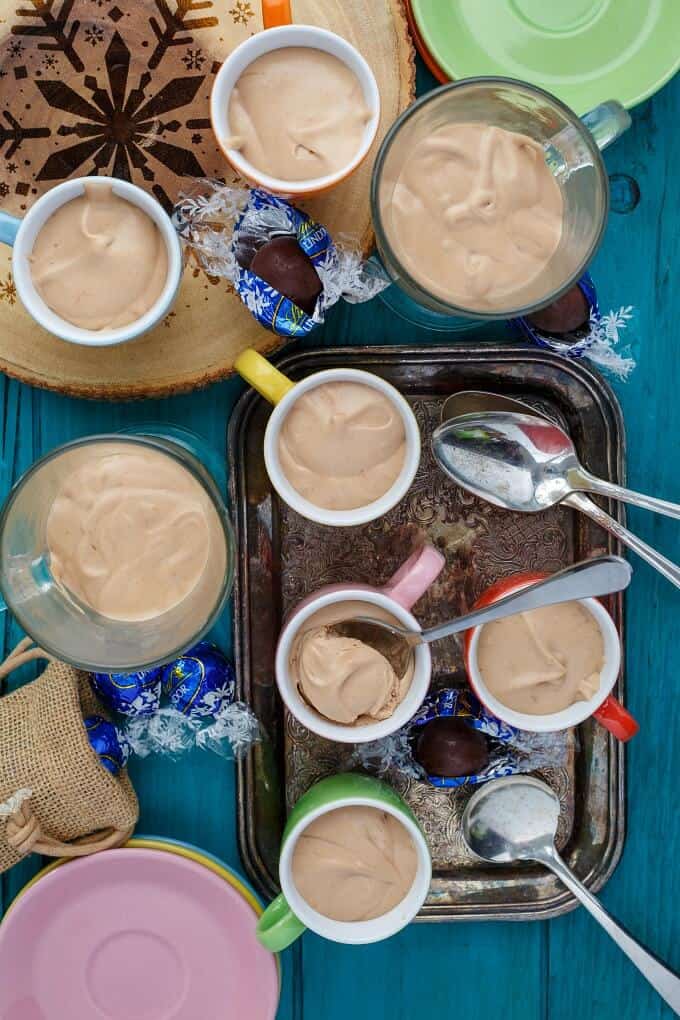 Lindt Lindor Chocolate Mousse in colorful cup with spoon on tray and table with lindor chocolate candy 