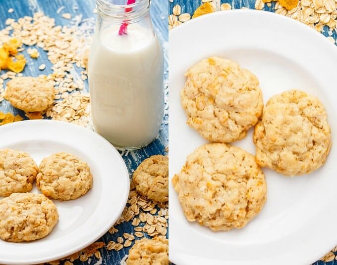 Forest Ranger Cookies on white plates on blue table spilled with ingredients around and jar of milk with pink straw