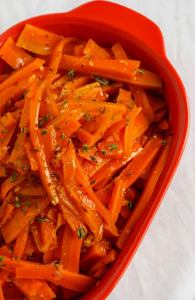 Honey-Glazed Carrots with Fresh Thyme in red container