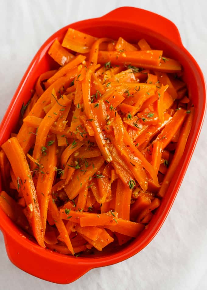 Honey-Glazed Carrots with Fresh Thyme in red container