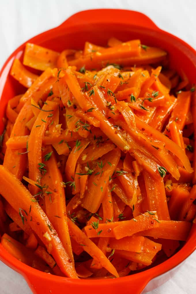 Honey-Glazed Carrots with Fresh Thyme in red container