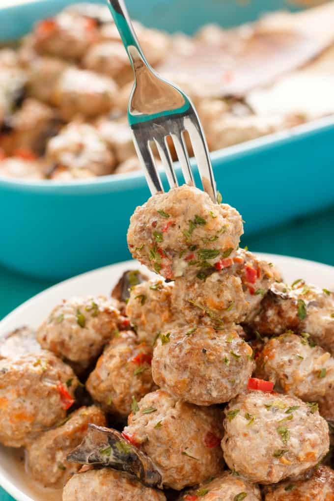 Turkey Meatballs in a Creamy Portobello Mushroom Sauce  on white plate picked by fork