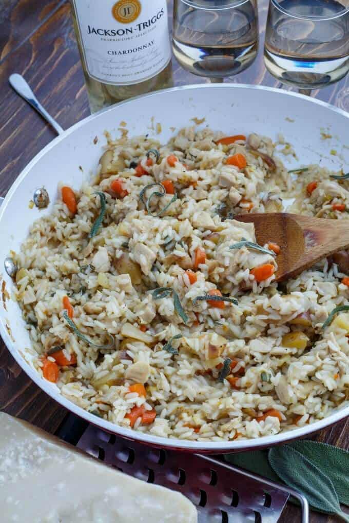 Leftover Thanksgiving Turkey Risotto in pan with wooden spatula