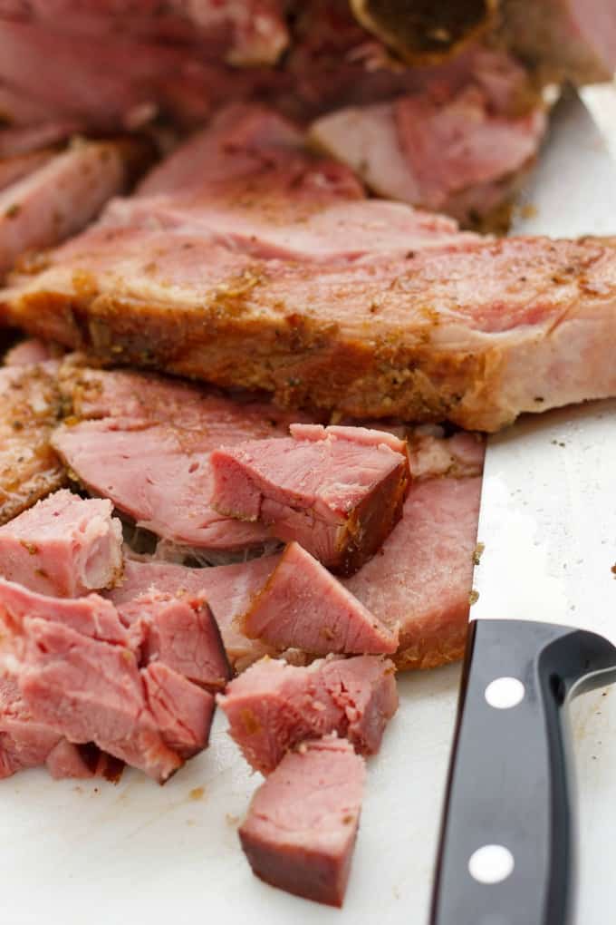 Herb Crusted Ham in the Slow Cooker sliced by knife