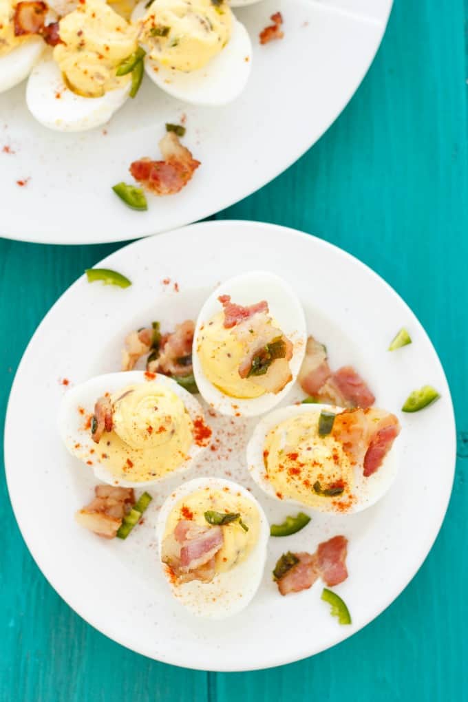 Jalapeno Popper Deviled Eggs on white plates 