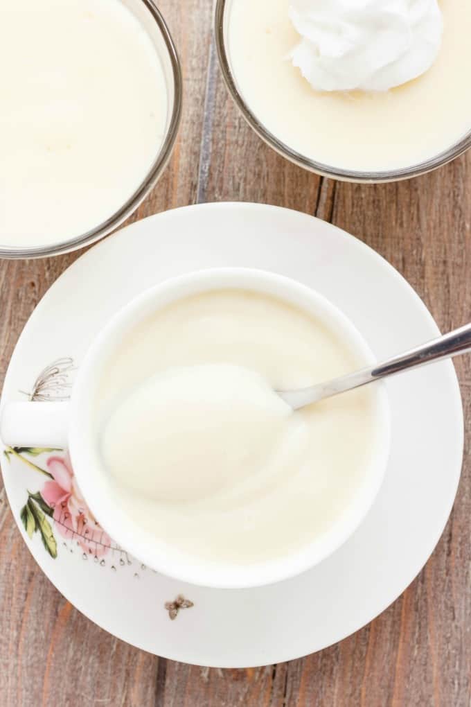 Homemade Vanilla Pudding in coffe cup with spoon