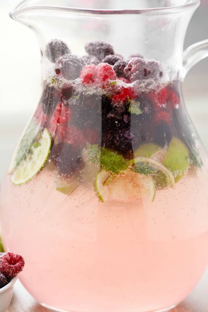 Mixed Berry Mojito in glass jar with limes and berries