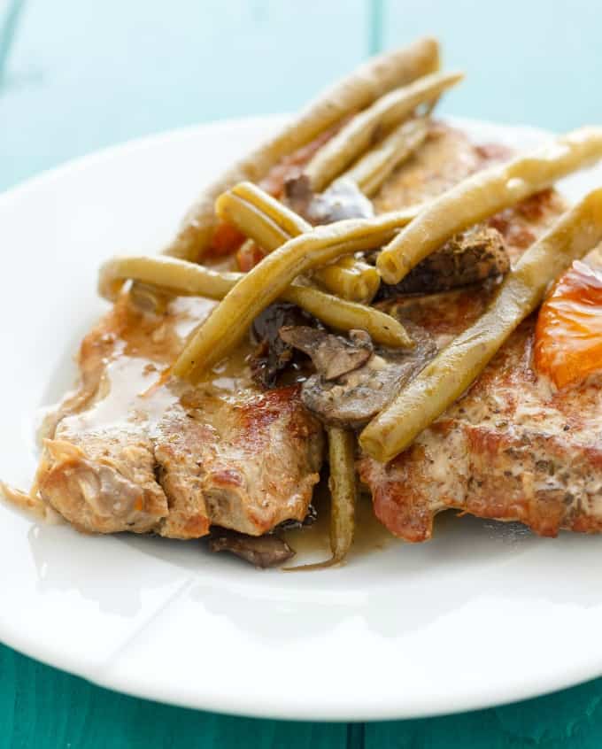 Pork Chops with Green Beans in the Slow Cooker on white plate #slowcooker