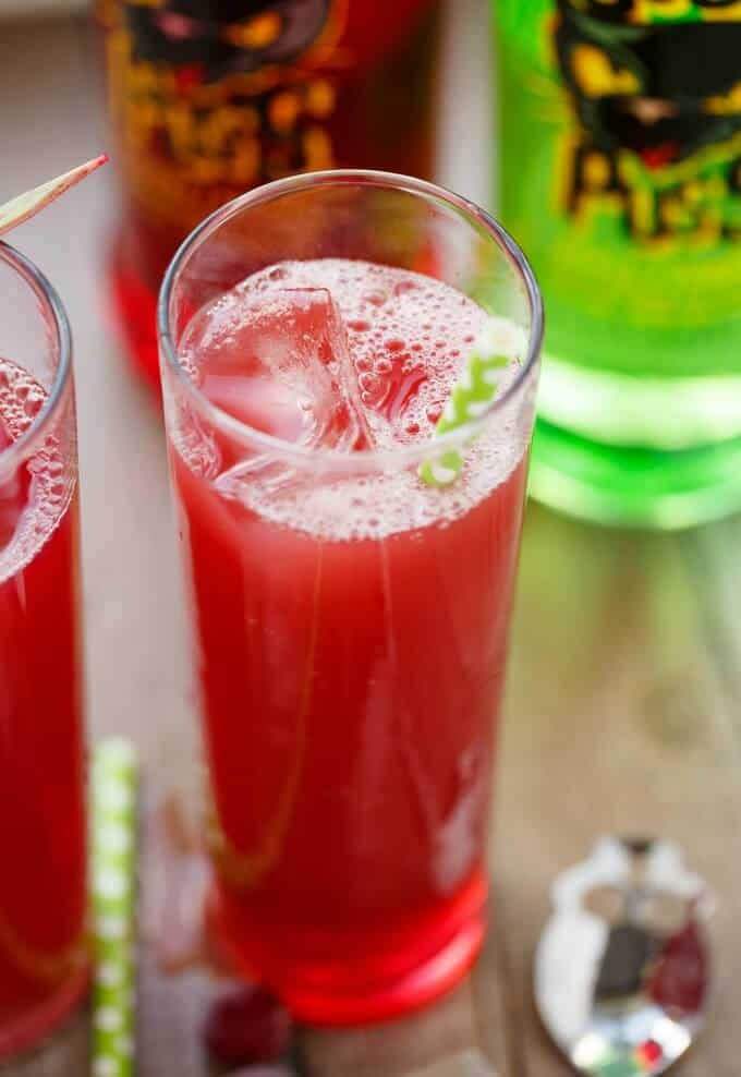 The Sour New Yorker drink in glass cup with straw and ice cube