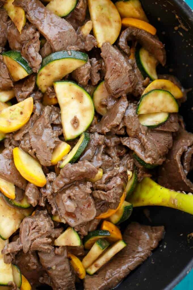 Beef and Zucchini Stir Fry with Roasted Broccoli in pot with green spatula
