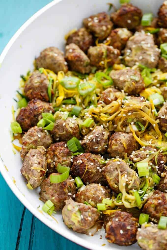 Miso Meatballs over Sauteed Zucchini Noodles in white bowl