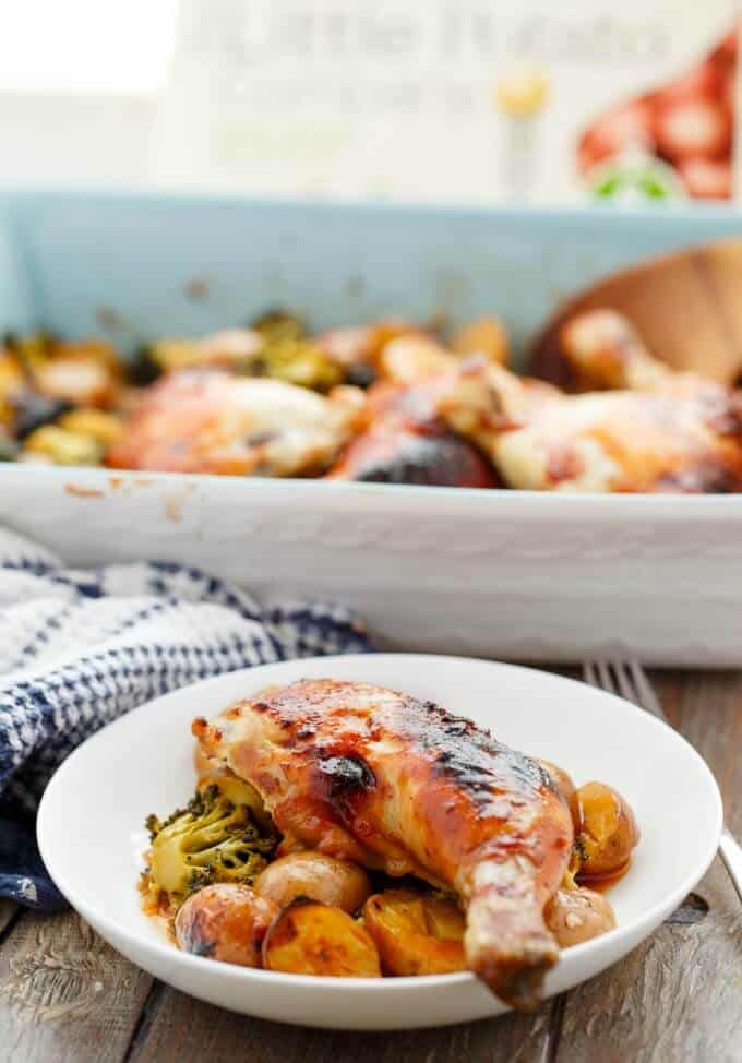 General Tso's Potatoes and Chicken in baking pot , on white plate next to fork and cloth wipe