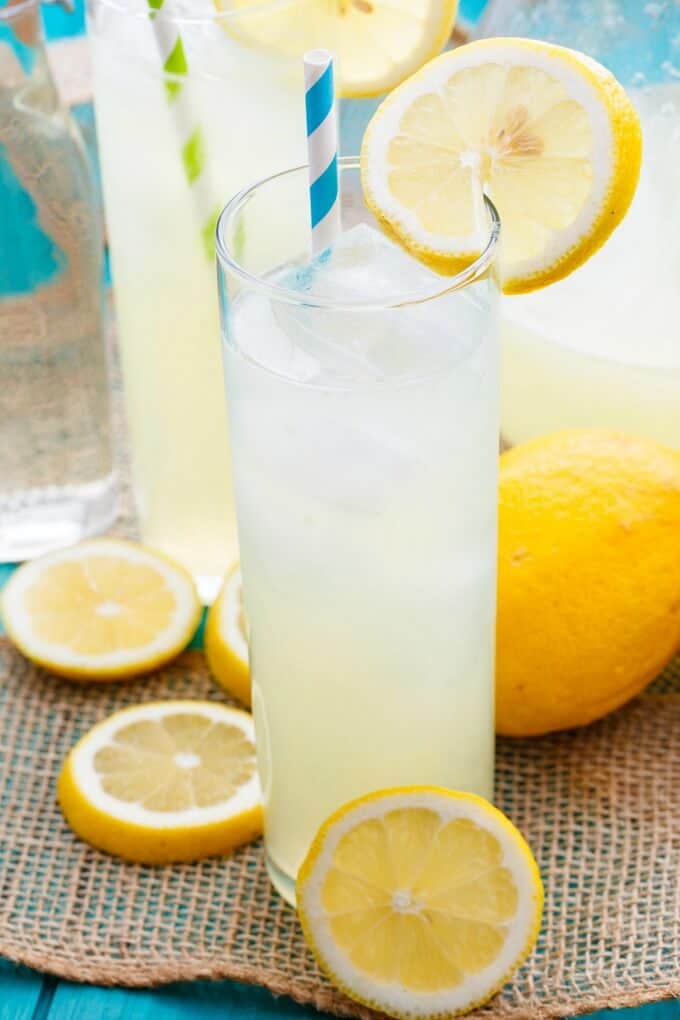 Homemade Roasted Lemonade in glass cups with straws with lemonade slices