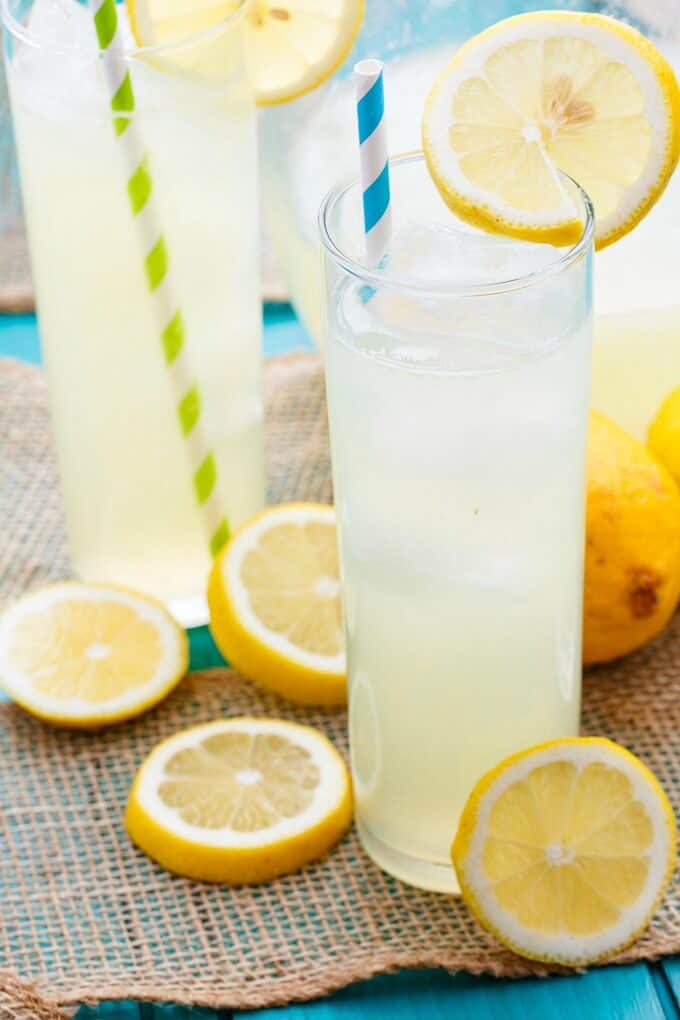 Homemade Roasted Lemonade in glass cups with straws and slices of lemonade
