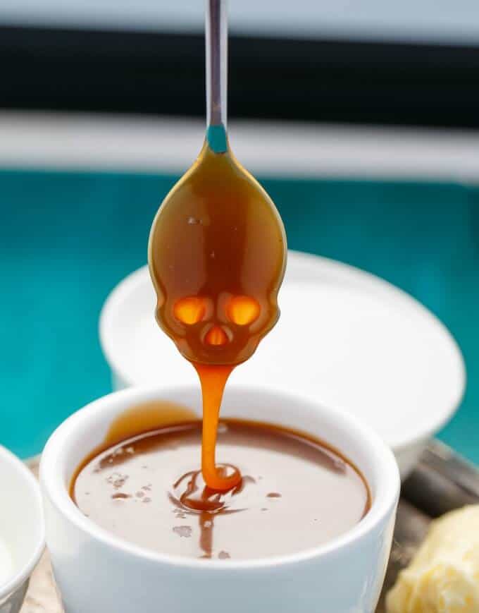 Dry Method Caramel Sauce in white bowl with spoon