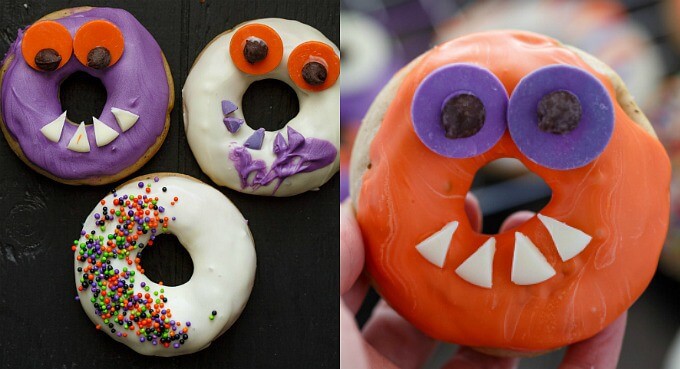 Halloween Monster Doughnuts on black table, doughnut held by hand