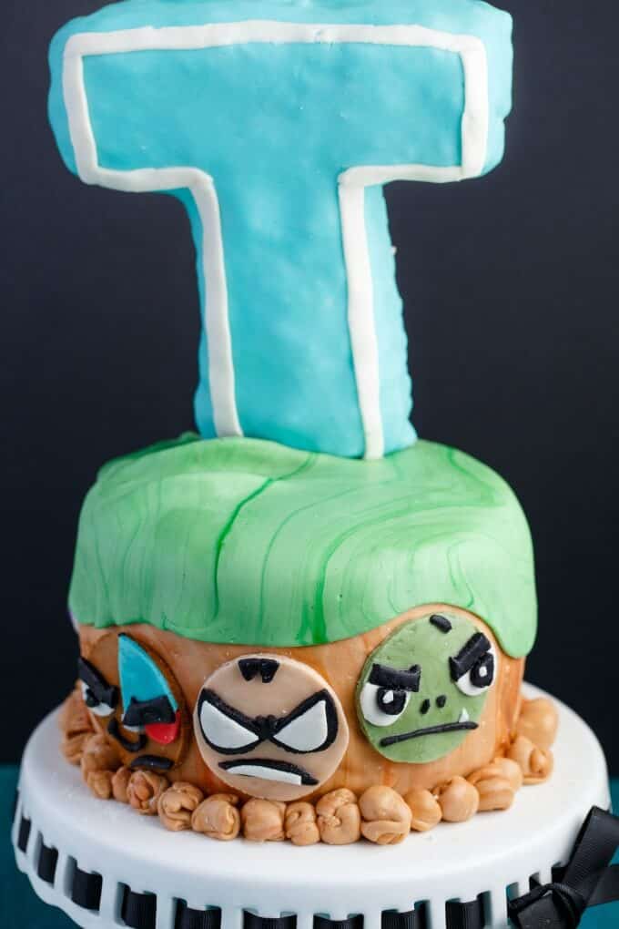 Teen Titans Go Cake on white tray, black background