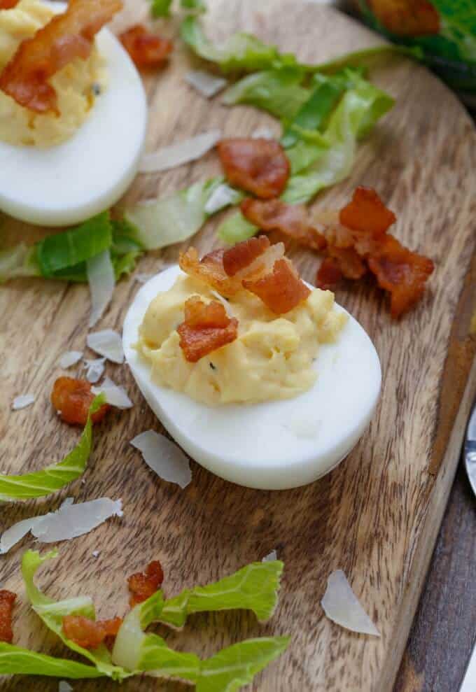 Caesar Deviled Eggs (Caesar "Salad") on wooden pad