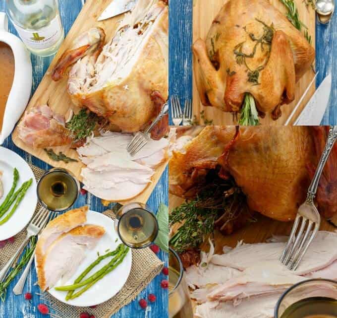 Smoked Turkey  on wooden pad and white plates with vegetables on blue table with forks, wine glasses