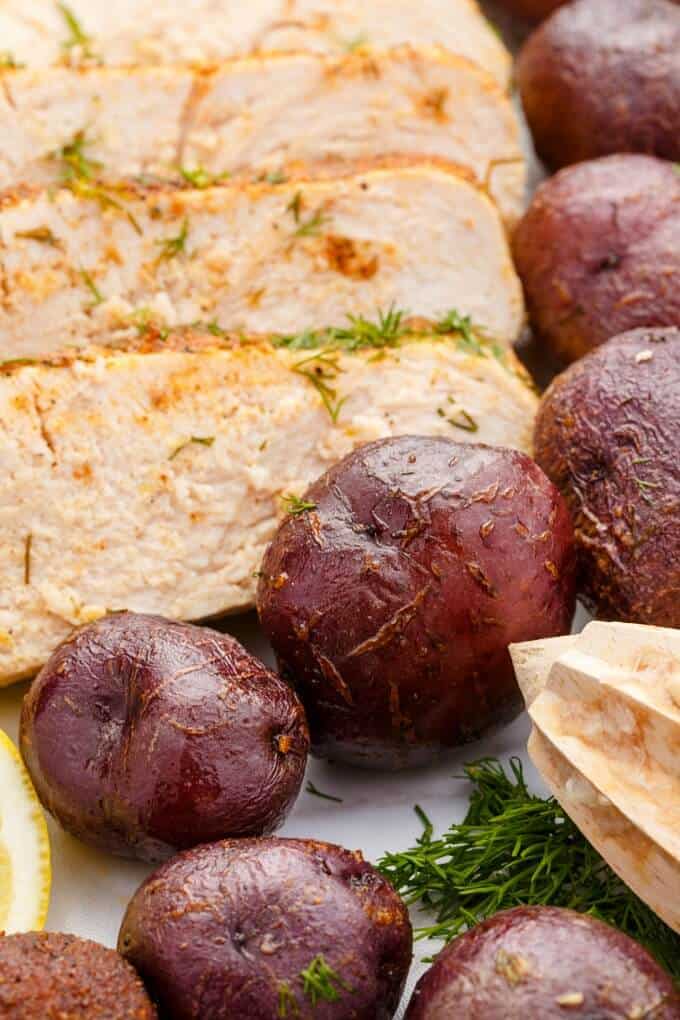 Slow Cooker Lemon-Dill Turkey Breast  with cooked potatoes and herbs