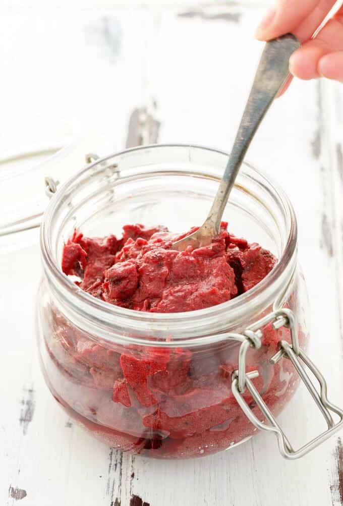 Slow Cooker Cranberry Butter in glass jar with spoon (Vegan/GF)