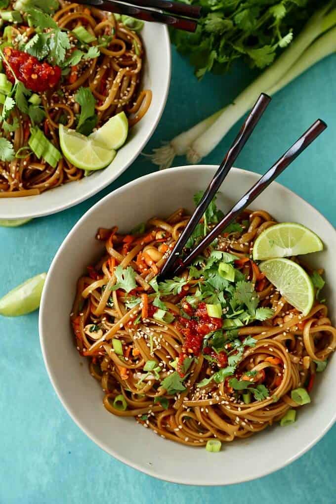 20 minute spicy thai noodles in white bowls with sticks