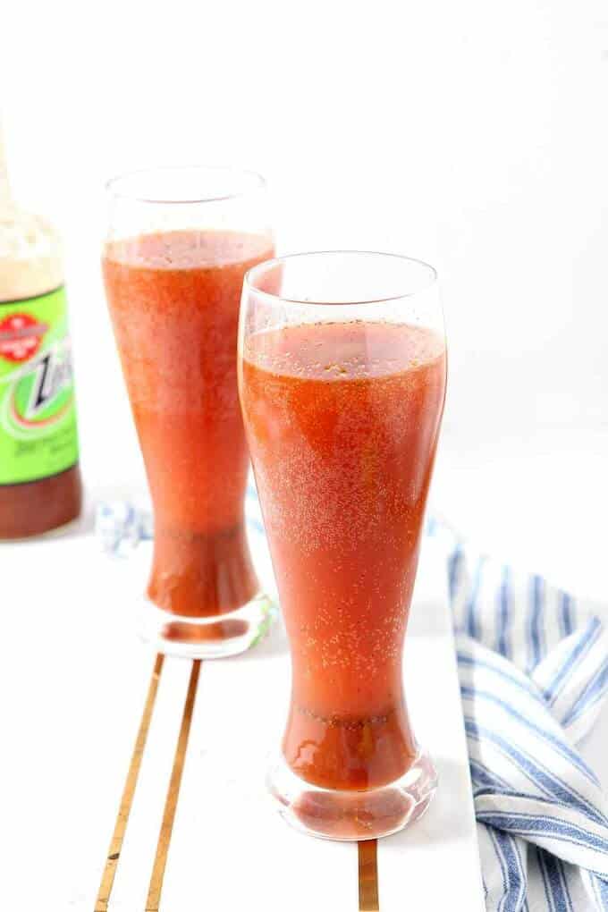 Spicy bloody beer coctail in glass cups