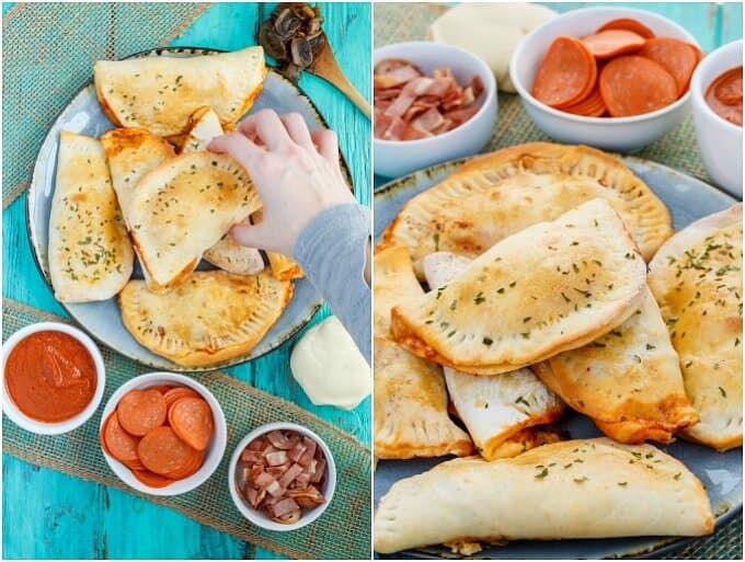 Homemade Pizza Pockets ( on blue tray touched by hand with pizza dough, bowls of ingredients and wooden spatula on blue table