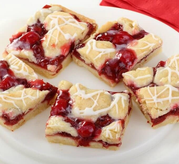 Cherry pie bars on white plate