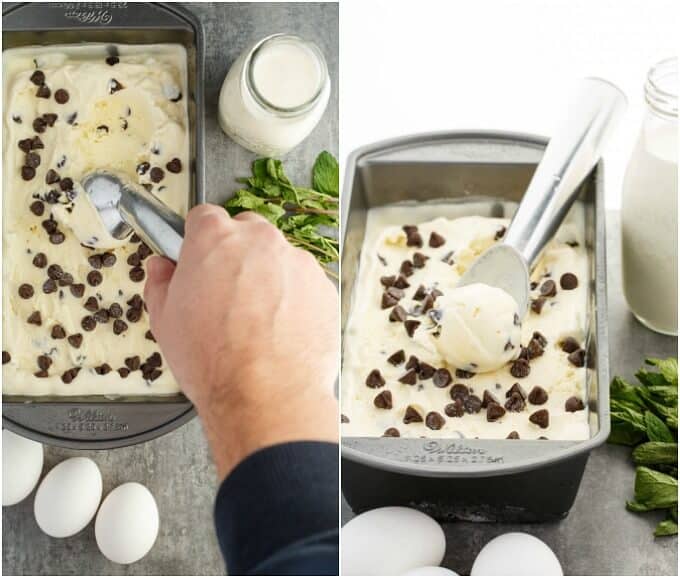 Homemade Fresh Mint Chocolate Chip Ice Cream in black container with spoon held by hand, boiled eggs, herbs, glass jar of milk on the table