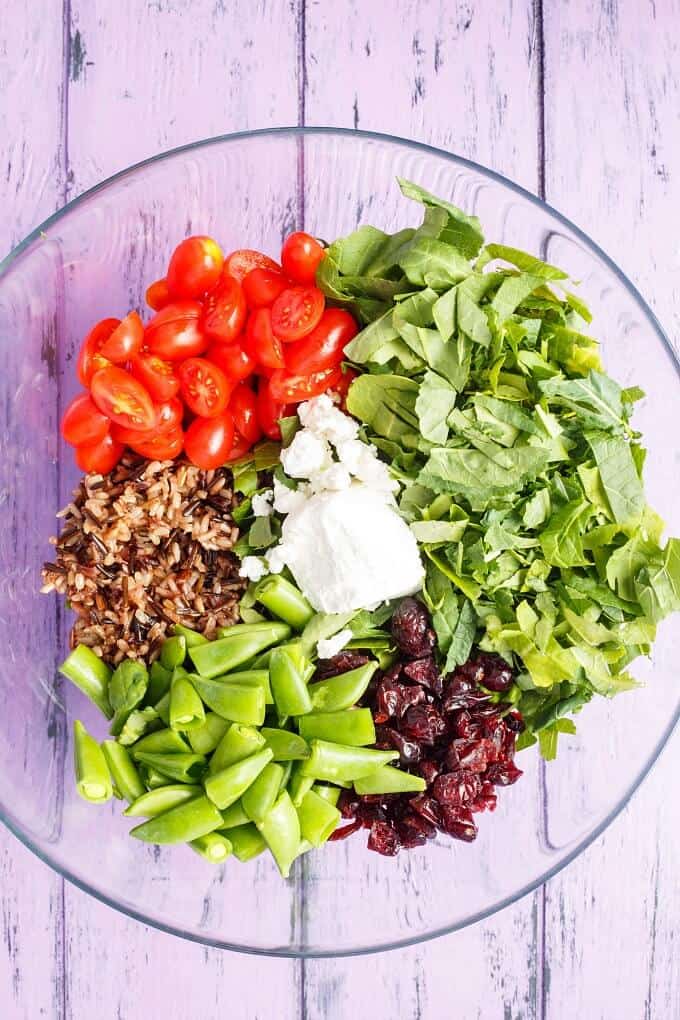 Roasted Mushroom Wild Rice Salad on glass plate on purpel table