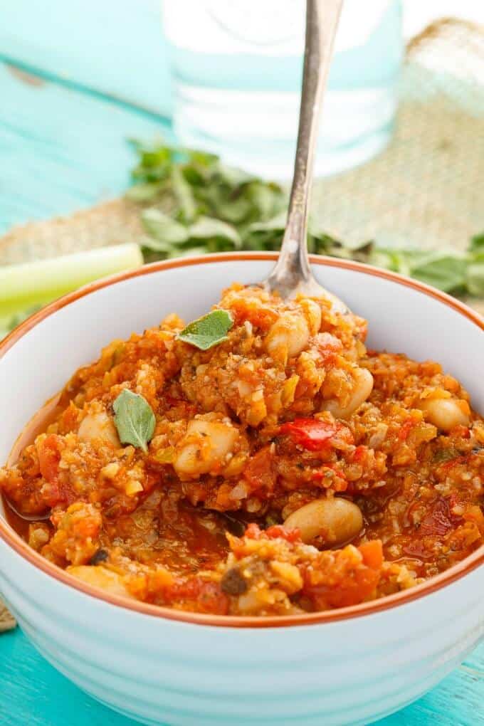 "Meaty" Vegetarian Chili in white bowl with spoon