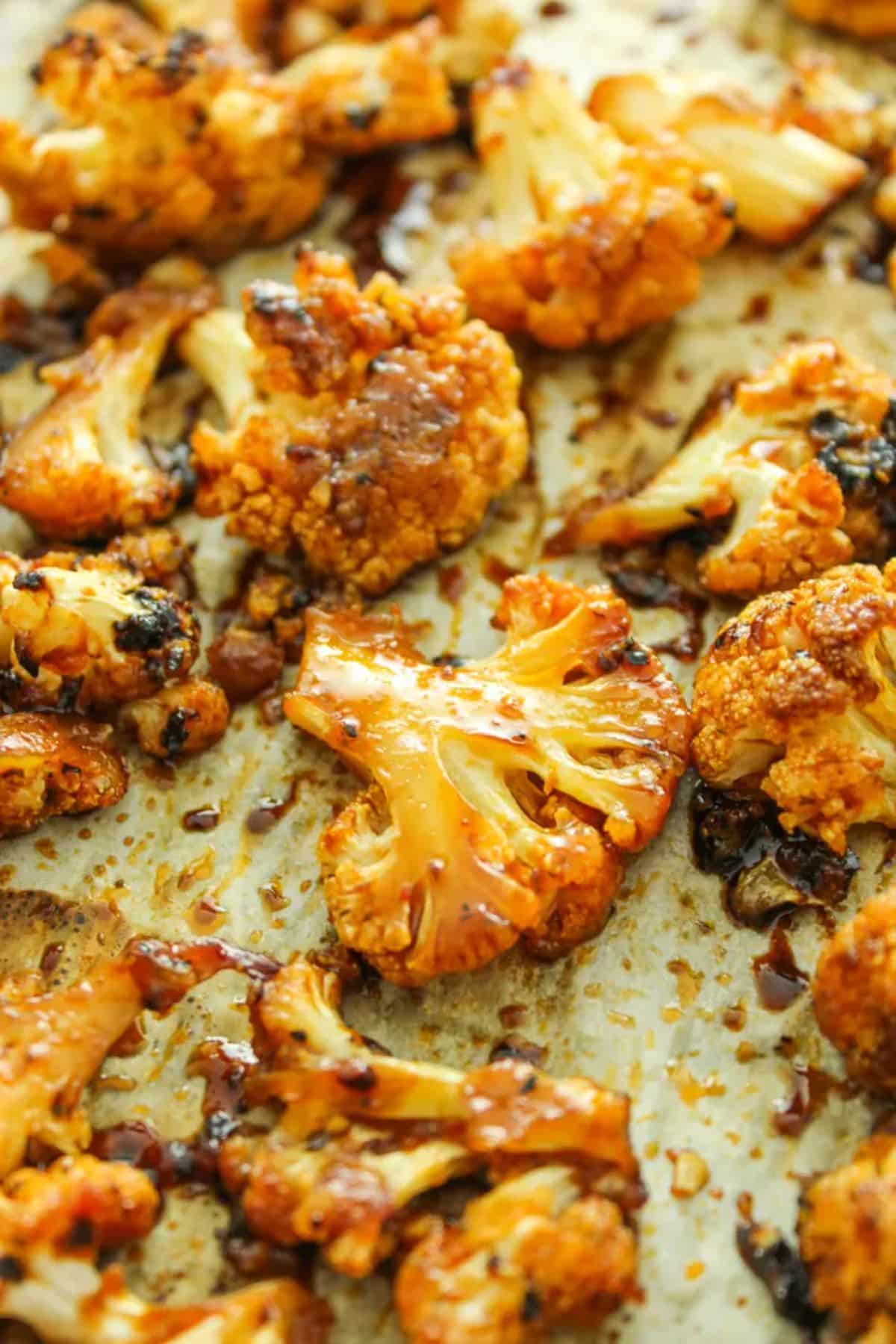 Juicy Sweet and Spicy Baked Cauliflower on a tray.