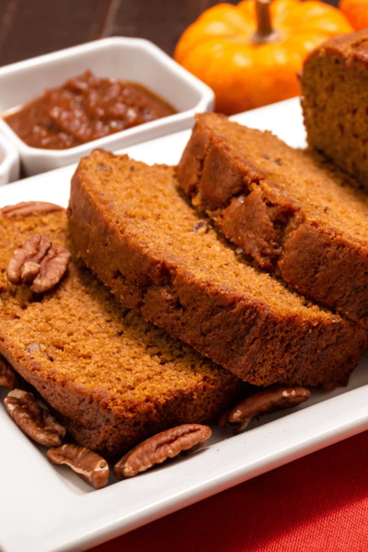 Delicious slices of Starbucks Pumpkin Bread on a white tray.