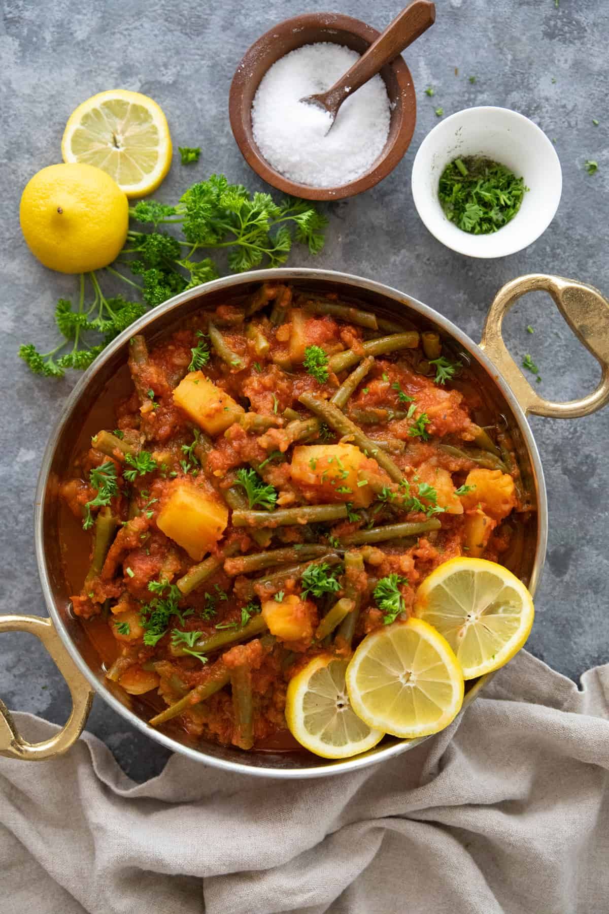 Juicy Fasolakia green bean dish in a pot.