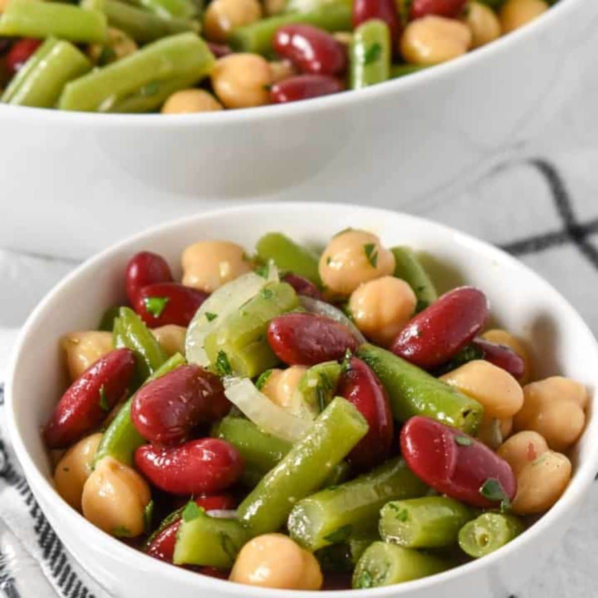 Healthy Three Bean Salad in a white bowl.