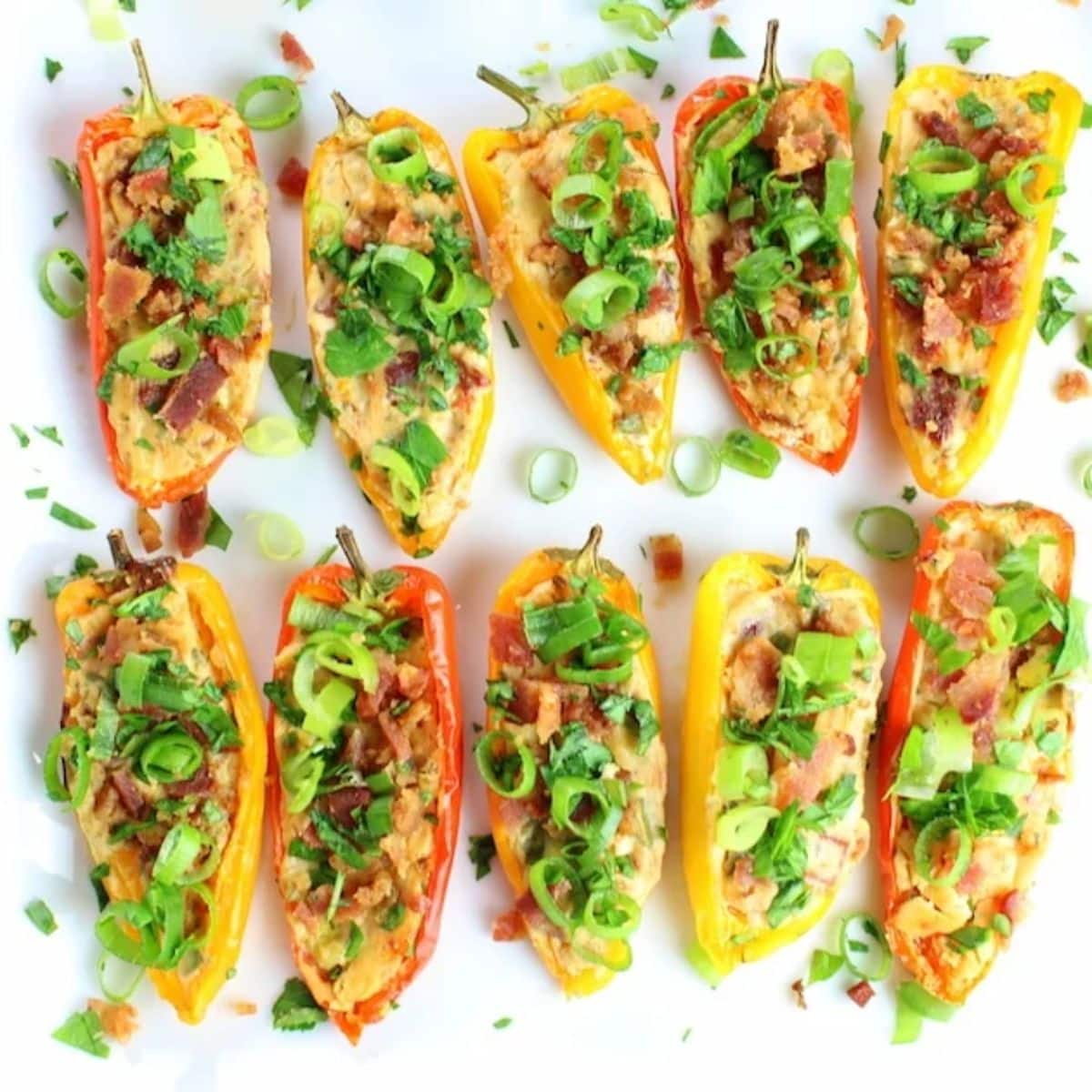 Tasty Cheesy Ranch Stuffed Mini Peppers on a white tray.