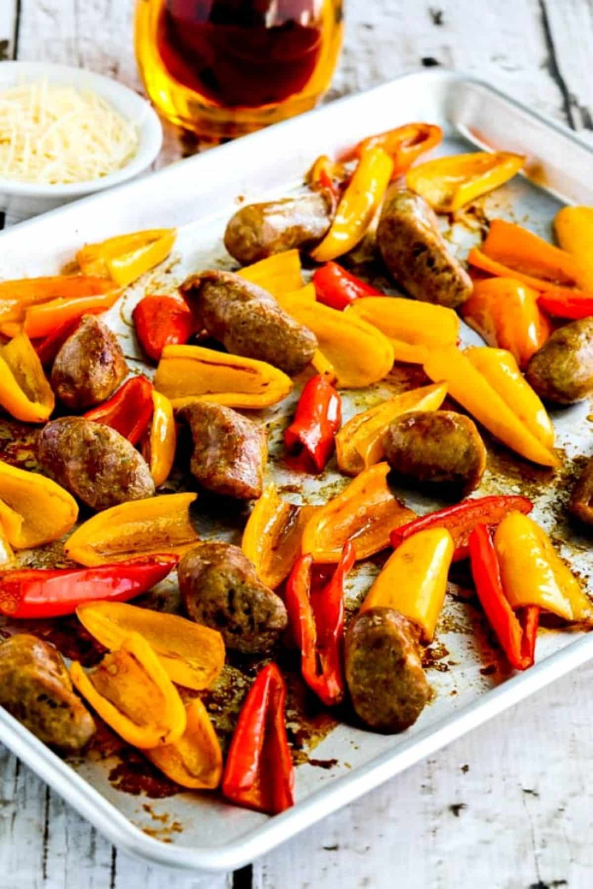 Scrumptious Italian Sausage and Sweet Mini Pepper Sheet Pan Meal on a baking tray.