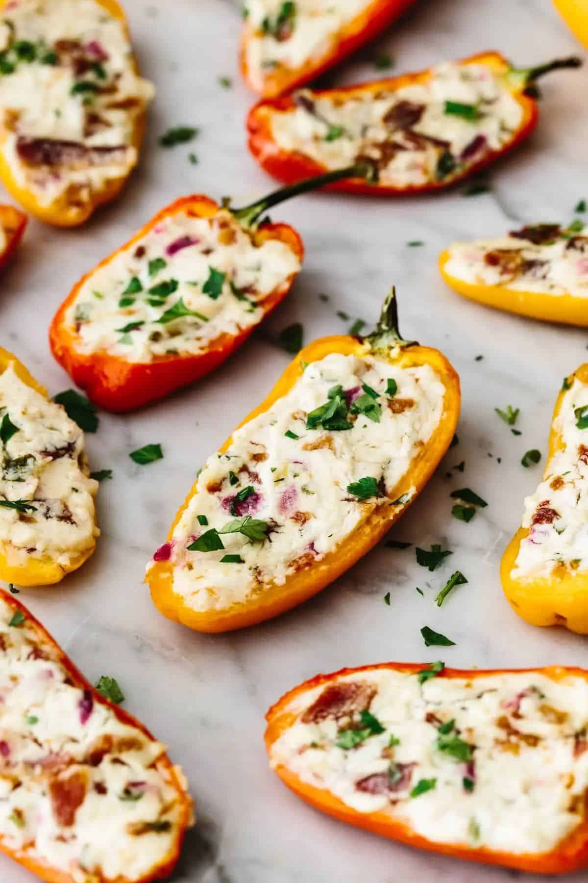 Flavorful Bacon and Goat Cheese Stuffed Mini Peppers on a table.