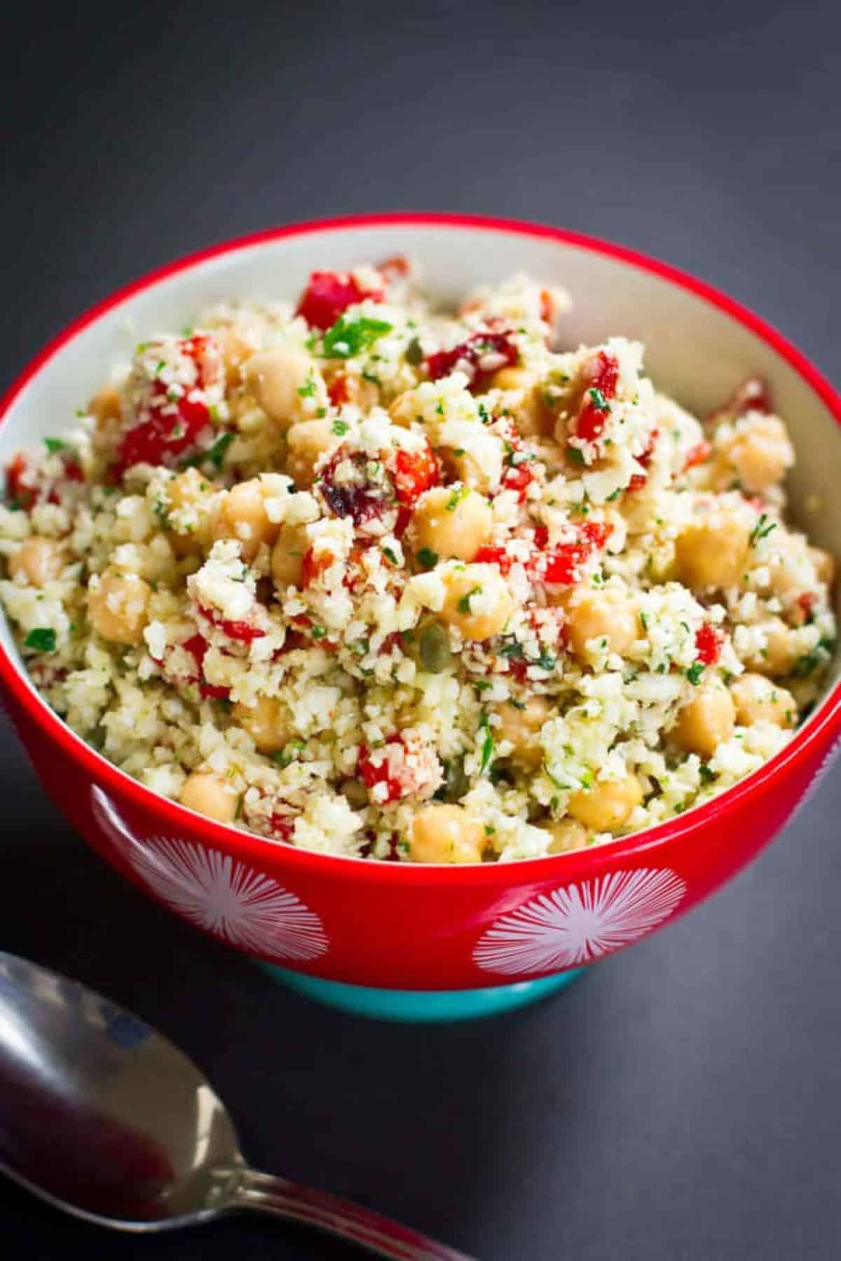 Healthy Mediterranean Cauliflower Salad in a red bowl.