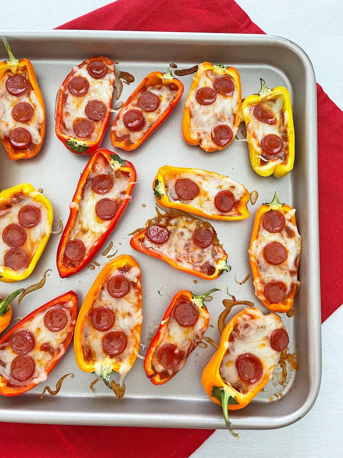 Tasty Mini Sweet Pepper Pizzas on a baking tray.