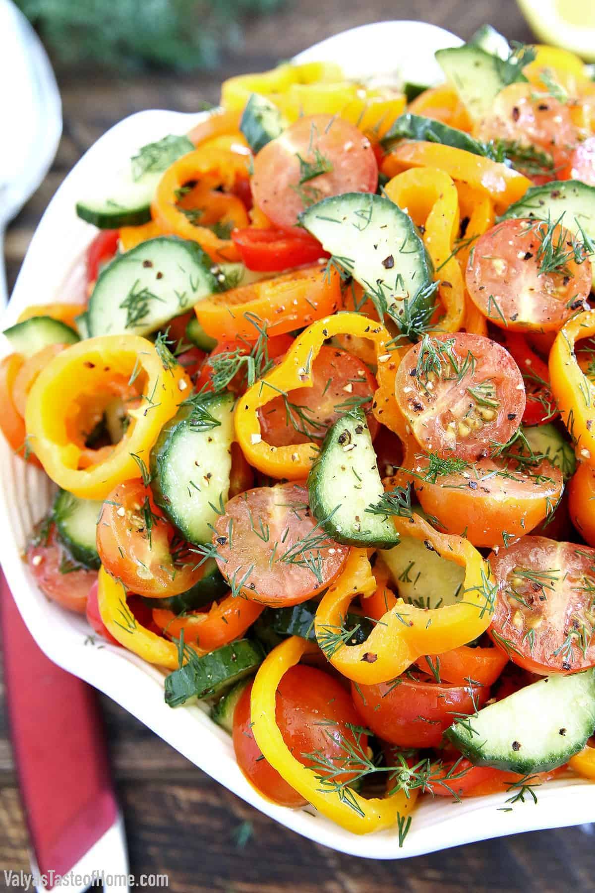 Fresh Sweet Pepper Tomato Cucumber Salad in a white bowl.