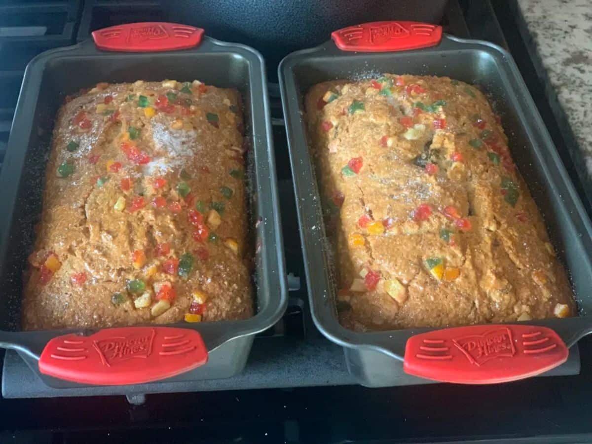 Two loaves of Coconut Sweet Bread in bread pans.