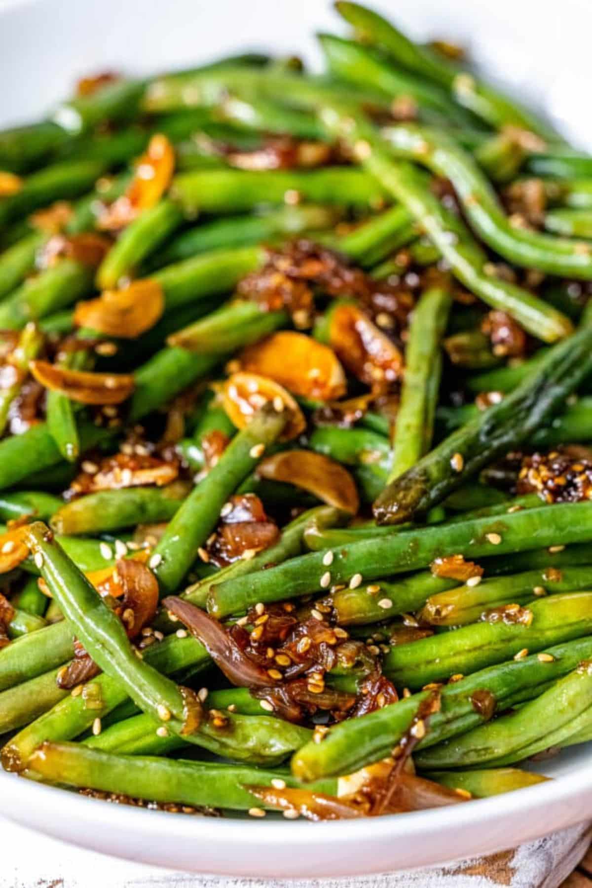 Healhty Garlic Chinese-Style Green Beans on a white plate.