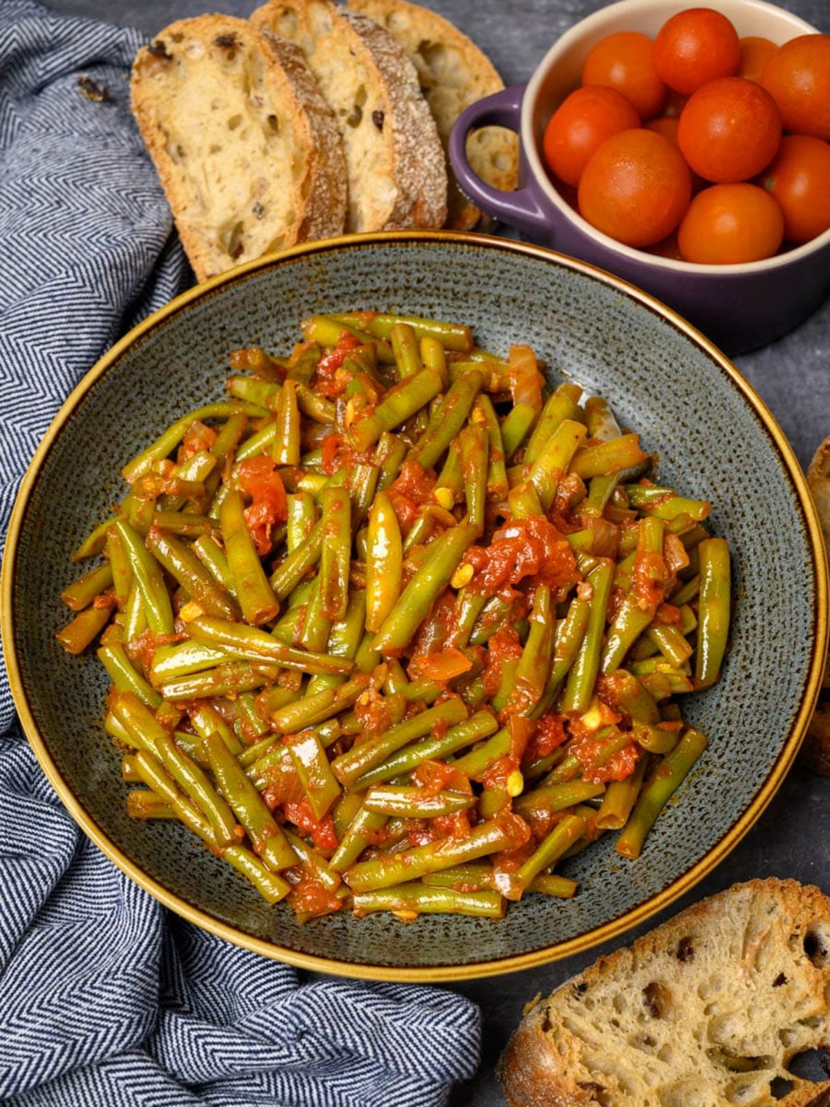 Juicy Loubieh green bean dish in a gray bowl.