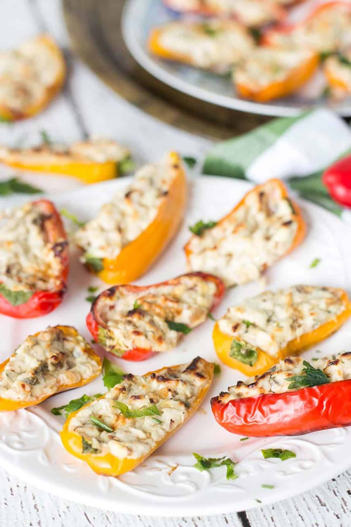 Mouth-watering Cream Cheese and Mushroom Stuffed Mini Bell Peppers on a white plate.