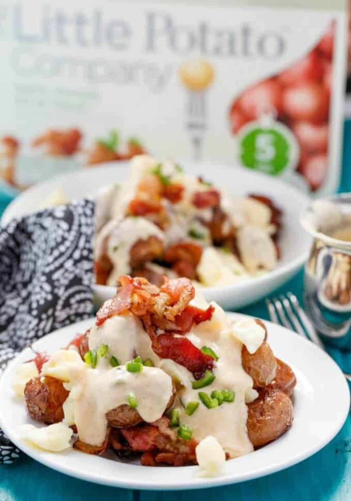 Scrumptious Jalapeno Popper Potato Poutine on a white plate.