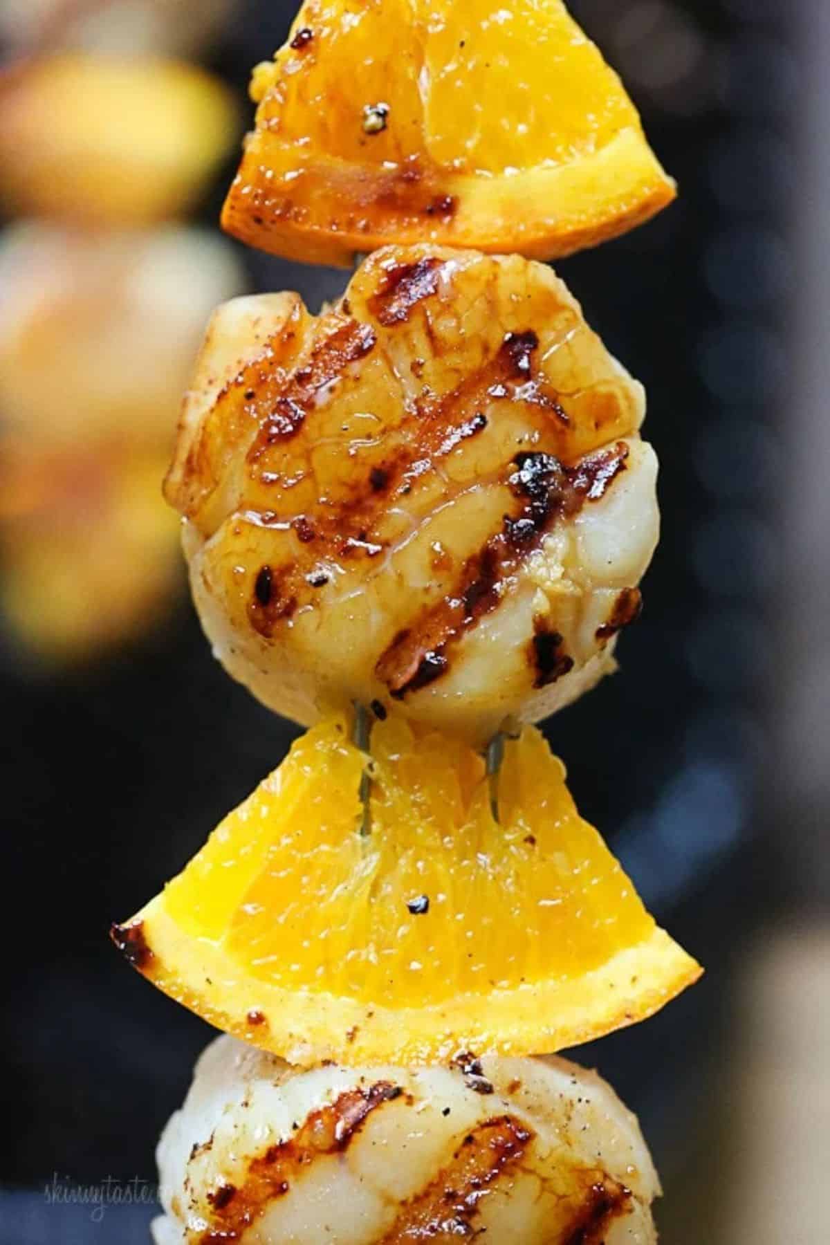 Mouth-watering Grilled Scallop and Orange Kebab.